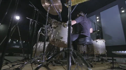 A drummer performing on his Drumset, dolly Stock Footage 55457269