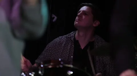 Drummer performing live on stage in night club Stock-Footage 50659729