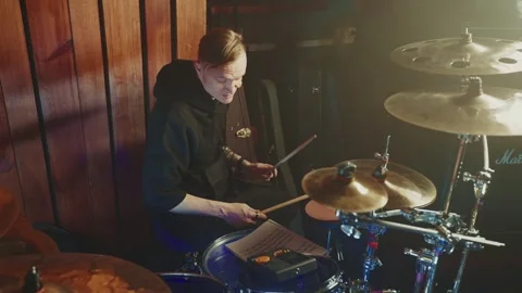 Drummer performs passionate solo in intimate music venue setting Stock Footage 295331402