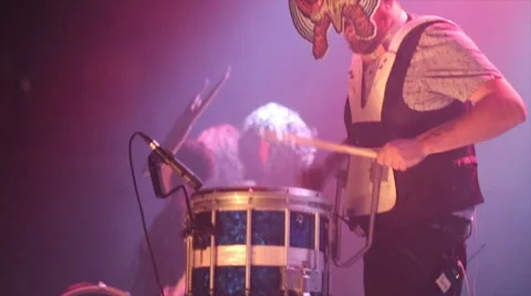 Drummer performs wearing mask on stage Stock Footage 49679984