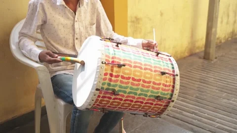 Drummer playing big drum in wedding, men plays a drum as a musical instrument Stockbeeldmateriaal 247020521