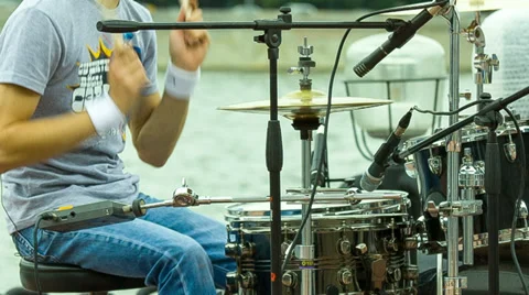 Drummer playing at a concert at the background of the river Stock Footage 39683203