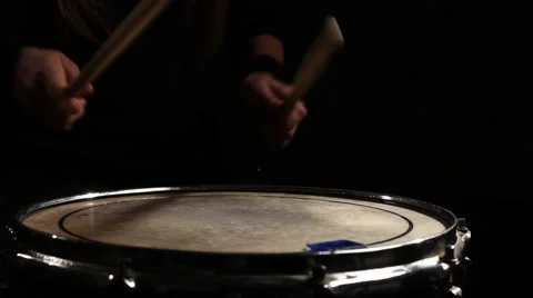 Drummer playing in a dark room . Close-up Stock Footage 56634593