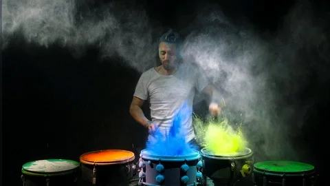Drummer playing the drum holi powder Stock Footage 102733697