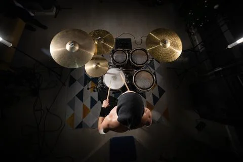 Drummer playing drum kit overhead top view Stock Photos