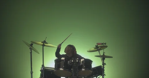 Drummer playing drum kit in slow motion Stock Footage 99990586