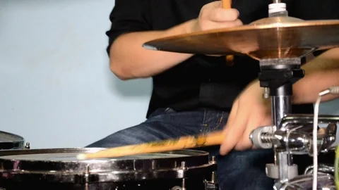 Drummer playing on drum set with drum and cymbals, playing with sticks Stock Footage 106301449