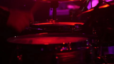 Drummer playing drum set live during a live concert Stock Footage 331083936
