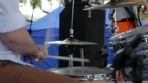 Drummer playing on drum set on stage Stock Footage 71480893
