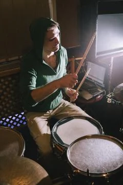Drummer playing drums in recording studio Stock Photos