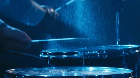 Drummer playing drums with water splashes Stock-Footage 118047068