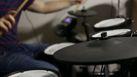Drummer playing at the electronic drums kit Stock Footage 72192796