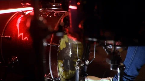  drummer playing an exercise with his right foot on a red drum set. close-up Stock Footage 105455203