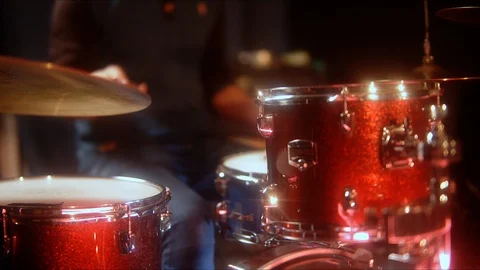 Drummer playing a jazz lesson at a red drum set in the rehearsal room Stock Footage 105455779