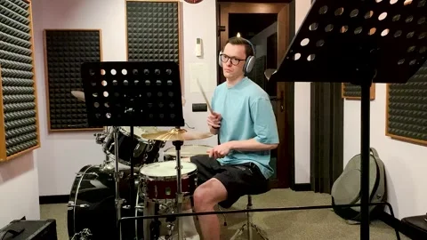 Drummer playing in a recording studio Video stock 313994097