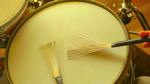Drummer playing snare drum with wire brushes in a soft jazz technique Stock-Footage 342906657