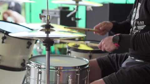 Drummer plays chopsticks on drums. Beats drum sticks on plates and drum set Stock Footage 202132553