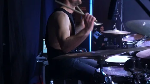 The drummer plays cool drums. Crazy drummer at a rock concert.  Stock Footage 127896573