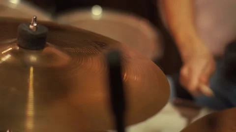 The drummer plays on a dark stage in the light of lanterns during a concert Stock Footage 144921909