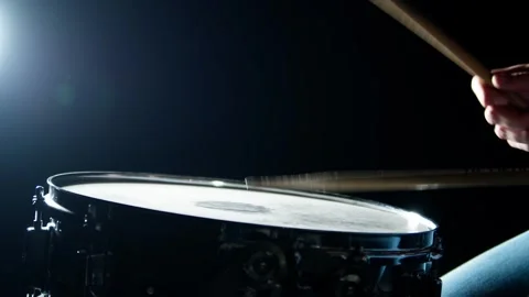 Drummer plays drum rudments, practise rolls, on snare drum. Side view Stock Footage 345590828