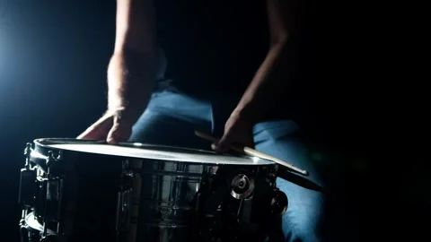 Drummer plays drum rudments, practise rolls, on snare drum, in slow motion Stock Footage 345590846