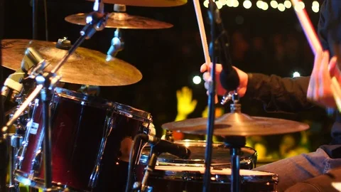 Drummer plays drums under the spotlight Stock Footage