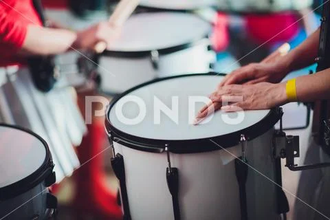 Drummer plays with drumsticks on rock drum set Stock Photos
