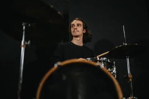 Drummer Practicing in Studio with a Focus on His Musical Skills Stock Photos