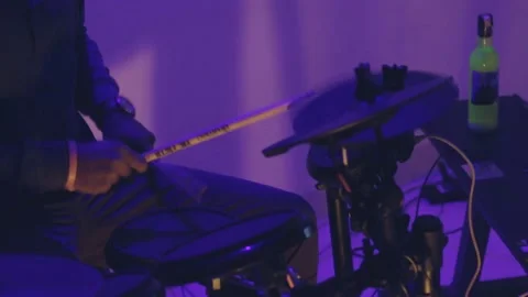 Drummer Rocks his Kit Hard in Purple Lights Stock Footage 203185995