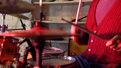 The drummer is sitting at the drum kit.. Close-up of drumming. Stock-Footage 122505408