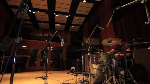 Drummer tuning drums in Recording Studio As 12 Stock Footage 35311694