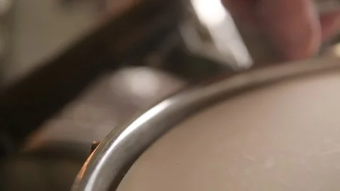 Drummer tuning the tom toms to get the drum kit ready for recording Stock Footage 245148672
