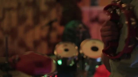 Drummer Using a Tambourine Stock Footage 76875184