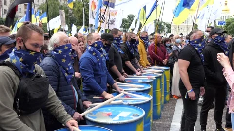 Drummers in a crowd of protesters, strikers, protesters, picketers, boycotters. Stock Footage 134635966