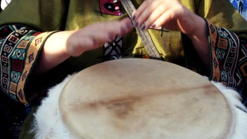 Drummers hands on an african djembe drum musical instrument ethnic beat Close up Video stock 116544697