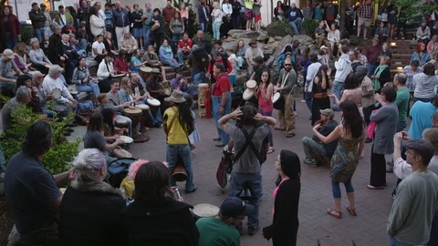 Drummers performing and people dancing around during the live street performance Stock Footage 103432829