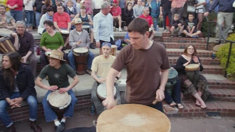 Drummers playing drums drum circle held Friday evenings in downtown Asheville, N Stock Footage 103435110