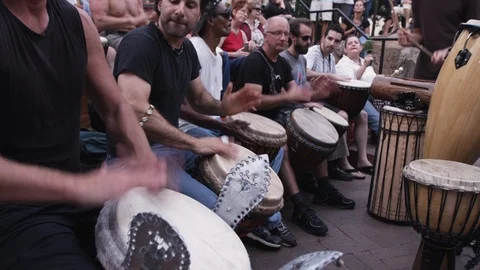 Drummers in a row at Drum circle in downtown Asheville, NC Stock Footage 103423910
