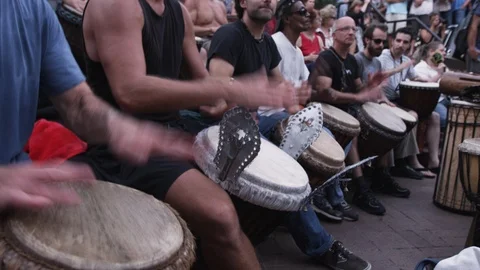 Drummers in a row performing at Drum circle in downtown Asheville, NC Video stock 103423796