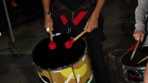 Drummers singing at a show beat the rhythm in their drums Stock Footage 80262778