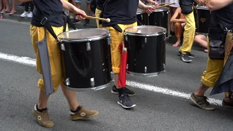 Drummers walk down the street in parade Stock Footage 114512154