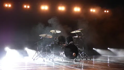 Drums on a dark stage in white light and fog. Stock Footage 144844410