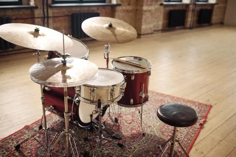 Drums set at empty musical studio Stock Photos