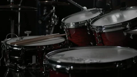 Drums slowmotion without drummer  sticks and headphones Stock Footage