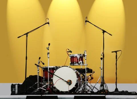 Drums on a yellow background Stock Photos