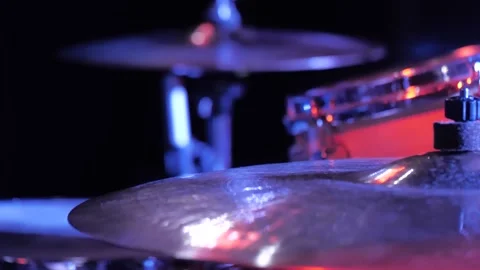  drumsticks actively and quickly hit the cymbals against the dark background  Stock Footage 156785621