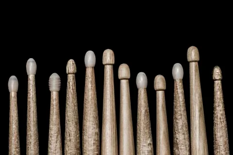 Drumsticks on a black background. Stock Photos