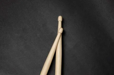 Drumsticks on a black background. Stock Photos