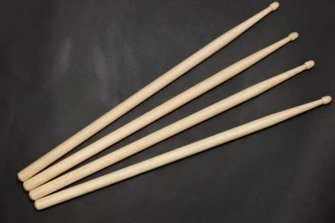Drumsticks on a black background. Stock Photos