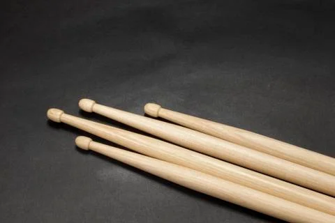 Drumsticks on a black background. Stock Photos